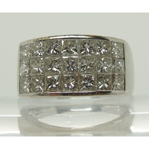 658 - An 18ct white gold and princess cut diamond ring made by Eric Smith