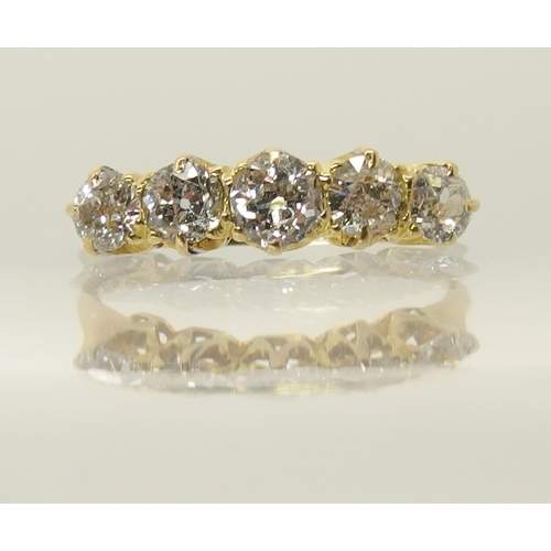 660 - An 18ct gold five stone diamond ring