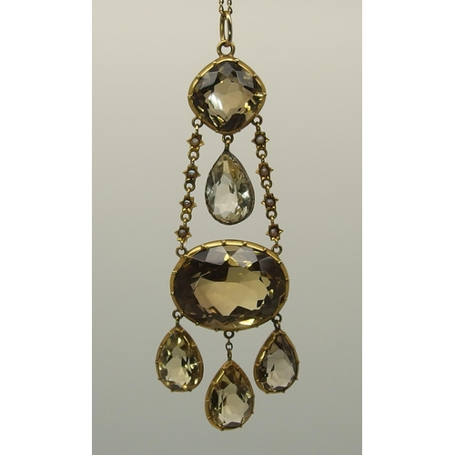 667 - A yellow metal mounted citrine pendant