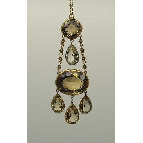 667 - A yellow metal mounted citrine pendant