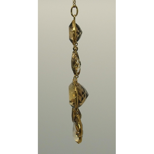 667 - A yellow metal mounted citrine pendant