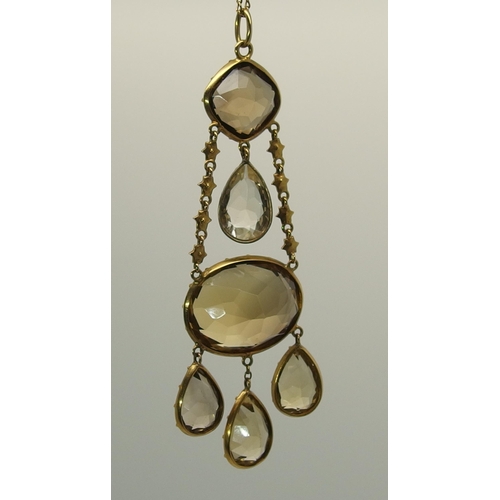 667 - A yellow metal mounted citrine pendant