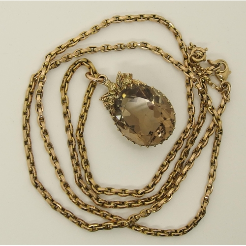 668 - A 9ct gold large smoky quartz pendant