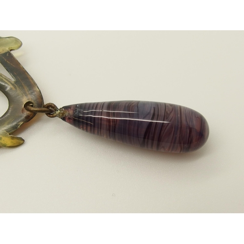 682 - An Art Nouveau carved and stained horn pendant necklace in the style of Madam Bonte