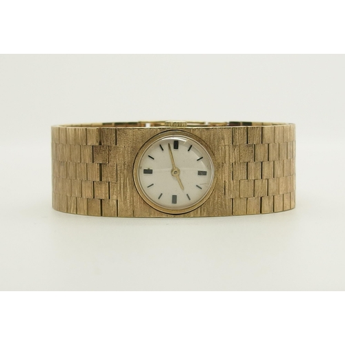 688 - A 9ct gold ladies cuff watch