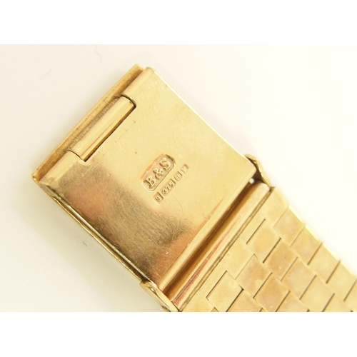 688 - A 9ct gold ladies cuff watch