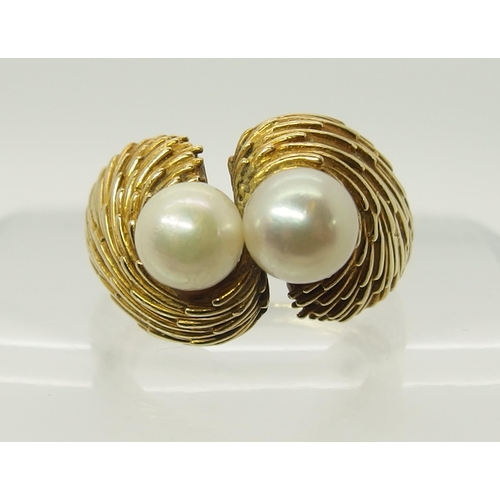 695 - A bright yellow metal twin pearl ring