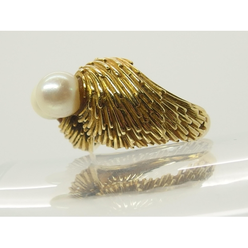 695 - A bright yellow metal twin pearl ring