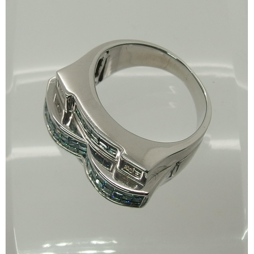 697 - A white metal blue & white diamond dress ring