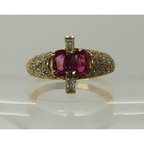 699 - A bright yellow metal diamond and pink sapphire dress ring