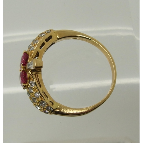 699 - A bright yellow metal diamond and pink sapphire dress ring