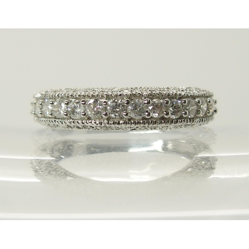 704 - A 14ct white gold diamond set eternity ring