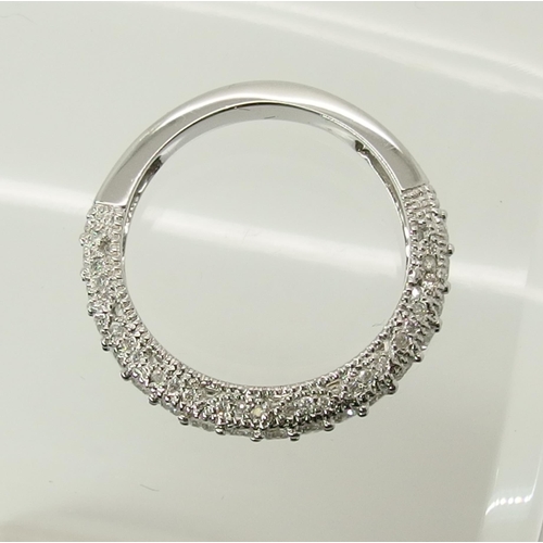 704 - A 14ct white gold diamond set eternity ring