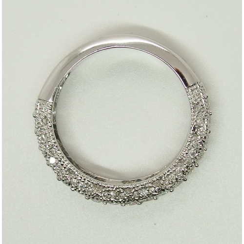 704 - A 14ct white gold diamond set eternity ring