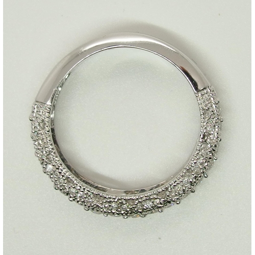 704 - A 14ct white gold diamond set eternity ring