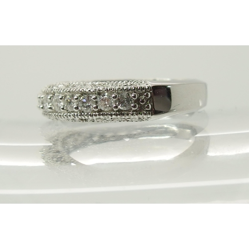 704 - A 14ct white gold diamond set eternity ring