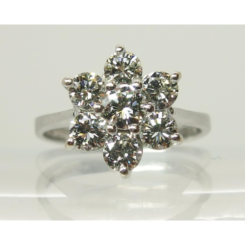 705 - An 18ct white gold diamond flower cluster ring