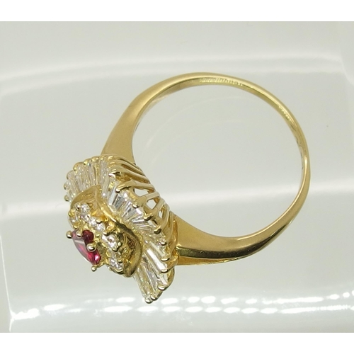 707 - A bright yellow metal diamond and ruby dress ring