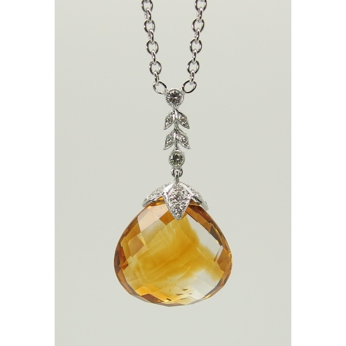 712 - A 18ct white gold citrine and diamond pendant