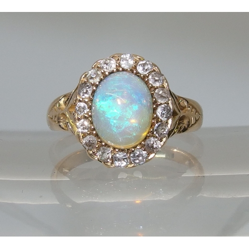 717 - An 18ct yellow gold jelly opal and old cut diamond ring