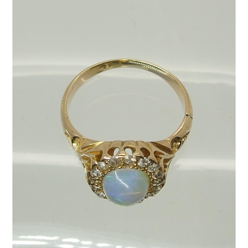 717 - An 18ct yellow gold jelly opal and old cut diamond ring