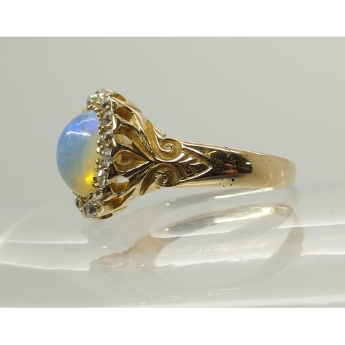 717 - An 18ct yellow gold jelly opal and old cut diamond ring