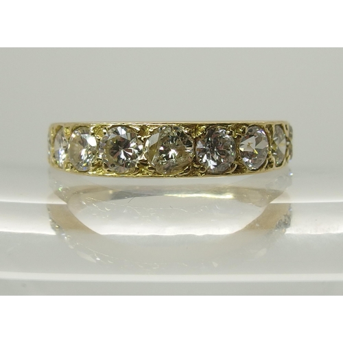 719 - An 18ct gold nine stone diamond ring