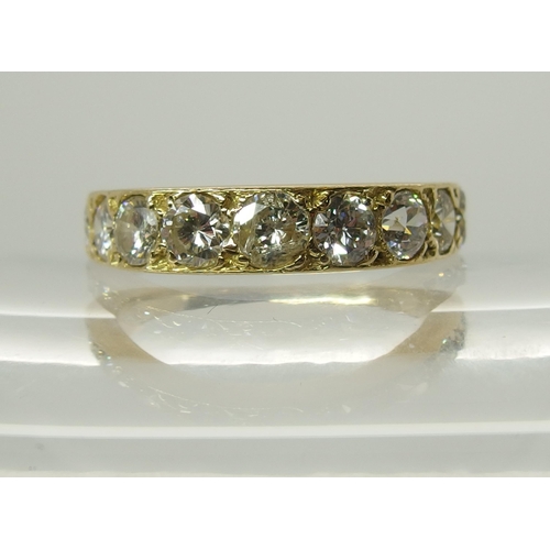 719 - An 18ct gold nine stone diamond ring