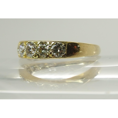 719 - An 18ct gold nine stone diamond ring