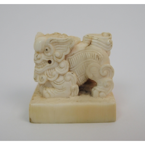 72 - A Chinese ivory shishi seal