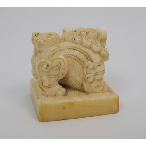 72 - A Chinese ivory shishi seal