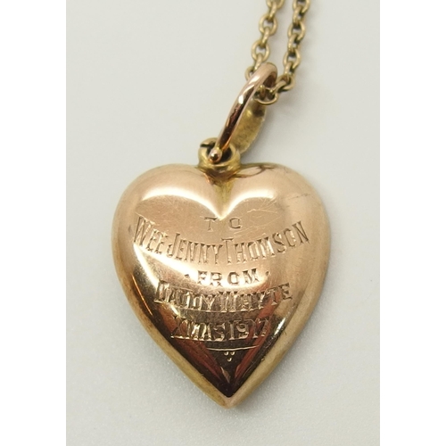 726 - A yellow metal heart shaped pendant