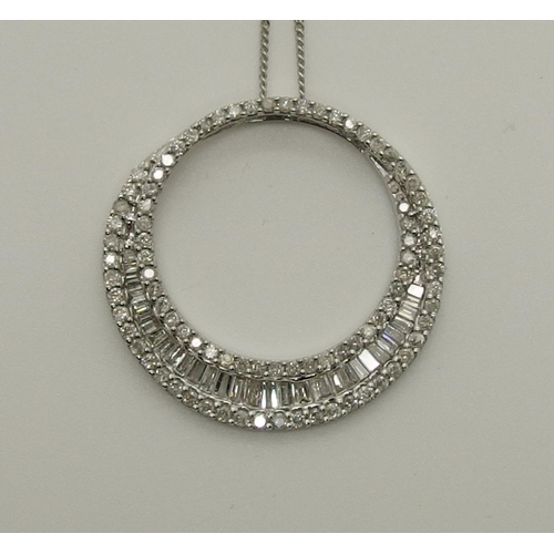 729 - A 9ct white gold diamond set circle pendant