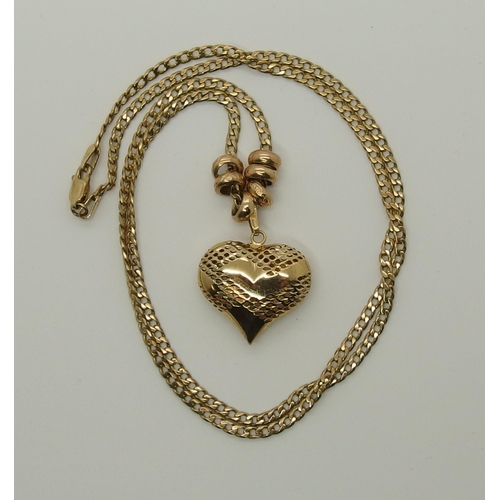 730 - A 9ct gold puffed heart pendant and chain