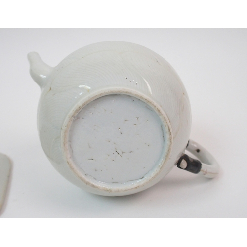 78 - A Chinese export moulded teapot