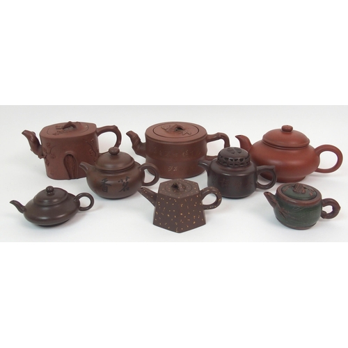 82 - Eight Yixing teapots