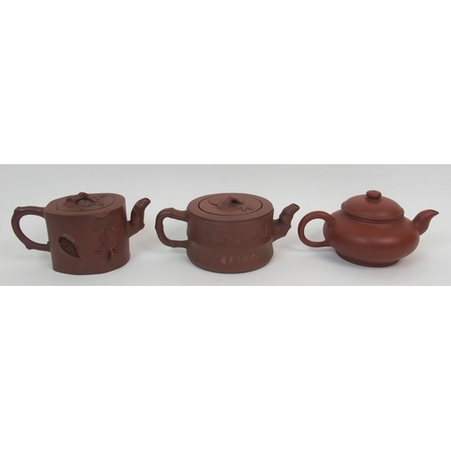 82 - Eight Yixing teapots