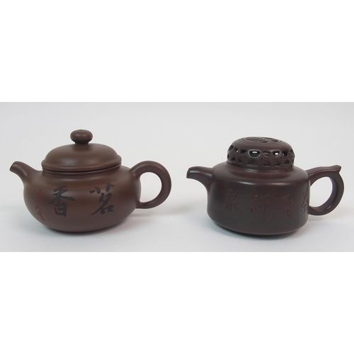 82 - Eight Yixing teapots