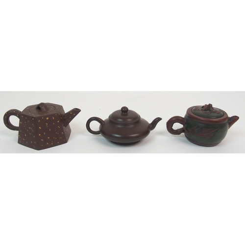 82 - Eight Yixing teapots