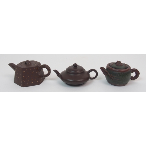 82 - Eight Yixing teapots