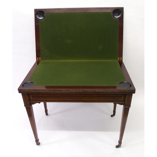 855 - An Edwardian mahogany and satinwood crossbanded games table