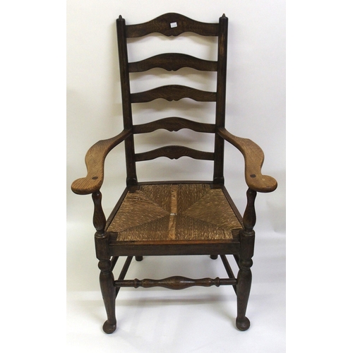 860 - A set of fourteen early 20th Century ash ladderback dining chairs