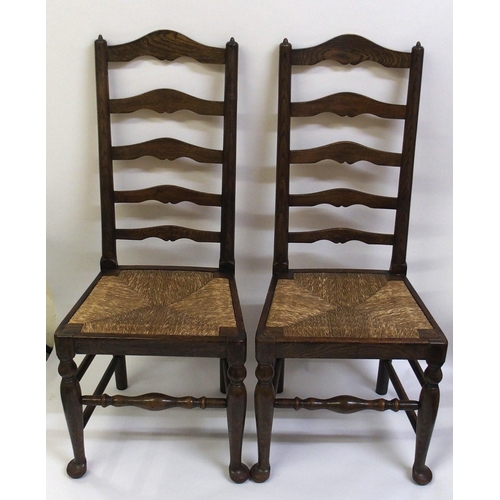 860 - A set of fourteen early 20th Century ash ladderback dining chairs