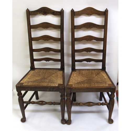 860 - A set of fourteen early 20th Century ash ladderback dining chairs