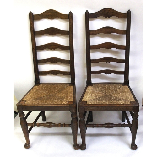 860 - A set of fourteen early 20th Century ash ladderback dining chairs