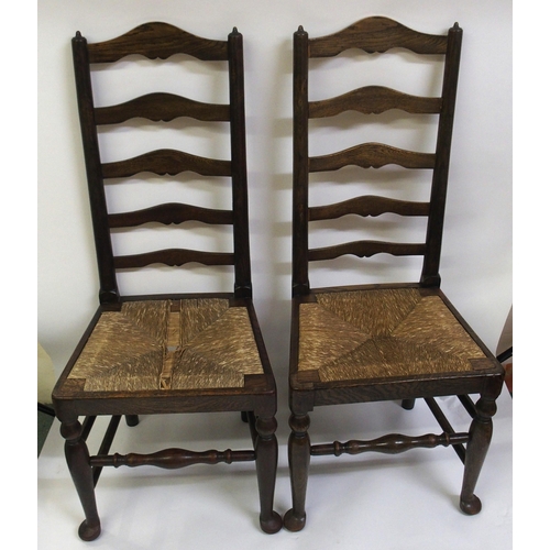 860 - A set of fourteen early 20th Century ash ladderback dining chairs