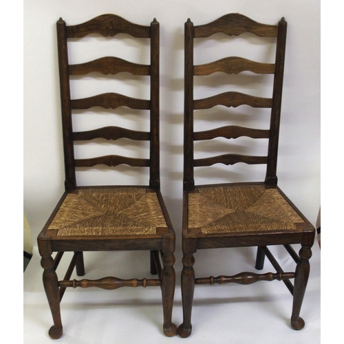 860 - A set of fourteen early 20th Century ash ladderback dining chairs