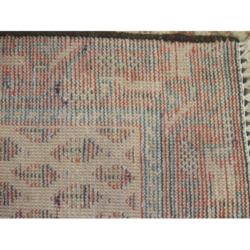 881 - A cream ground Araak rug