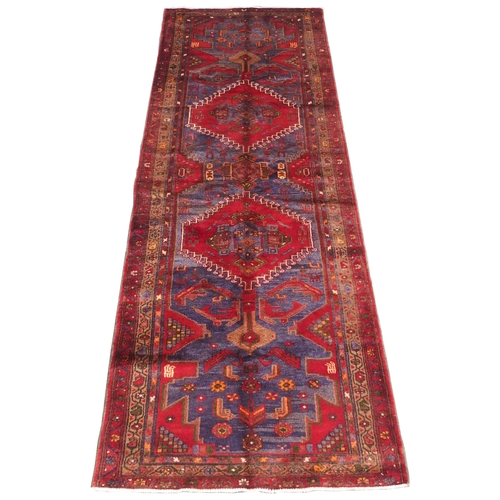 884 - A red and blue ground Hamadan runner