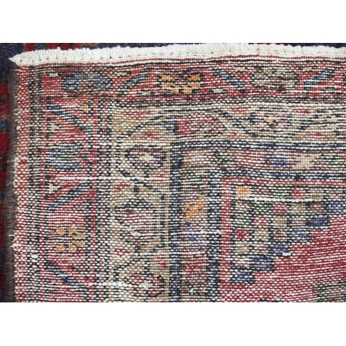 884 - A red and blue ground Hamadan runner